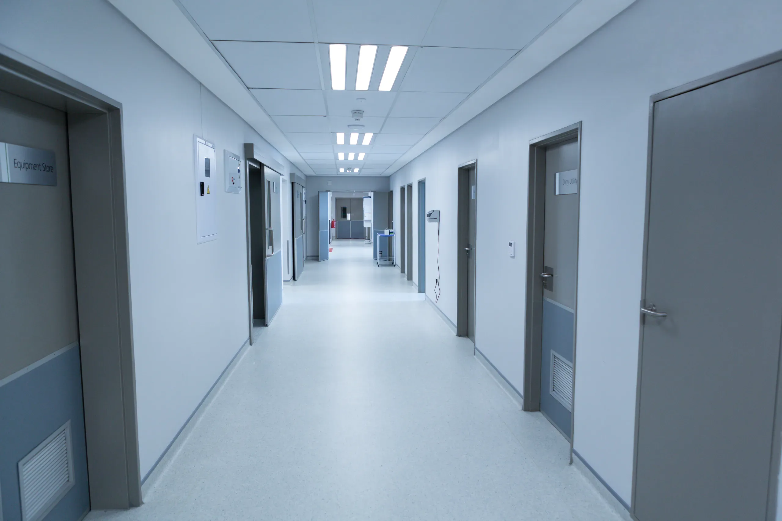 A corridor in a contemporary healthcare facility.